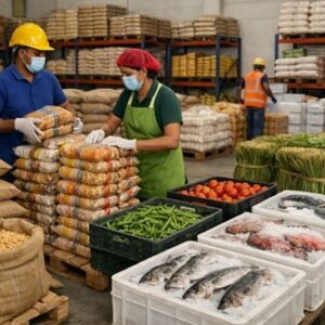 Staff packing fresh produce, grains and seafood at a Nuwaan Enterprises facility